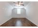 A spacious bedroom featuring a ceiling fan and hardwood flooring at 601 Cork St, Woodstock, GA 30188