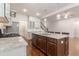Kitchen with granite countertops, stainless steel appliances, and central island with bar seating at 601 Cork St, Woodstock, GA 30188