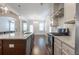 Kitchen with stainless steel appliances, granite counter tops, hardwood floors, and a center island at 601 Cork St, Woodstock, GA 30188