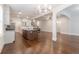 Bright kitchen featuring a large island, stainless steel appliances, and hardwood floors at 601 Cork St, Woodstock, GA 30188