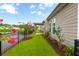 A beautiful backyard featuring lush landscaping and blooming trees at 601 Cork St, Woodstock, GA 30188