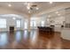 Spacious open-concept living area with hardwood floors, fireplace, and seamless flow into the kitchen and dining spaces at 601 Cork St, Woodstock, GA 30188