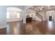 Spacious open-concept living area with hardwood floors, fireplace, and seamless flow into the kitchen and dining spaces at 601 Cork St, Woodstock, GA 30188