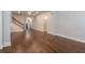 Spacious open-concept living area with hardwood floors, fireplace, and seamless flow into the kitchen and dining spaces at 601 Cork St, Woodstock, GA 30188