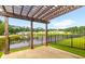 An outdoor patio that offers a scenic view of a pond and neighborhood at 601 Cork St, Woodstock, GA 30188