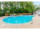 Sparkling community pool with lounge chairs for relaxing on a sunny day at 601 Cork St, Woodstock, GA 30188