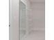 Walk-in closet with shelving and a full-length mirror, ideal for organization and dressing at 601 Cork St, Woodstock, GA 30188