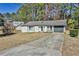 Charming single-story home with a driveway, neutral color, and well-maintained lawn at 3915 Basil Sw Way, Atlanta, GA 30331