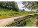 Sloping landscape featuring vibrant green vegetation and a dirt pathway at 399 Pratt Dr # 910, Atlanta, GA 30315