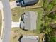 Aerial view of a well-maintained home with a green lawn, fenced yard, and a two-car driveway at 5780 Winding Lakes Dr, Cumming, GA 30028