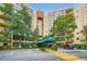 View of building entrance, covered by a green awning and marked with the address, 1800 at 1800 Clairmont Lk # A310, Decatur, GA 30033
