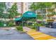 Covered building entrance with awning, landscaping, and a bench visible through the doorway at 1800 Clairmont Lk # A310, Decatur, GA 30033