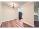 Well-lit dining space with modern chandelier and open layout to the kitchen at 1800 Clairmont Lk # A310, Decatur, GA 30033