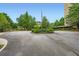 Circular driveway leading to the building entrance, with neatly landscaped greenery and an American flag at 1800 Clairmont Lk # A310, Decatur, GA 30033