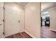 Entryway featuring wood floors and view of updated kitchen with black appliances at 1800 Clairmont Lk # A310, Decatur, GA 30033