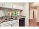 Kitchen featuring stainless sink, dishwasher, and granite countertops at 1800 Clairmont Lk # A310, Decatur, GA 30033