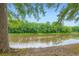 Scenic view of a tranquil lake surrounded by lush trees, offering a serene and picturesque landscape at 1800 Clairmont Lk # A310, Decatur, GA 30033