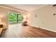 View of the living room with hardwood floors leading to an adjacent sunroom at 1800 Clairmont Lk # A310, Decatur, GA 30033