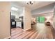 Living space showcasing hardwood floors and an open layout to the updated kitchen at 1800 Clairmont Lk # A310, Decatur, GA 30033