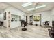 Salon space includes modern chairs, mirrors, wood-look flooring, and lots of natural light at 1800 Clairmont Lk # A310, Decatur, GA 30033