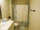 Cozy bathroom featuring a shower with floral curtain and a sleek vanity at 3411 Swallowtail Ter, Duluth, GA 30096