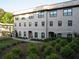 Attractive multi-story building with brick facade, well-maintained landscaping, and visible windows at 3411 Swallowtail Ter, Duluth, GA 30096