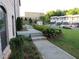 Well-manicured front yard with landscaped walkway leading to the townhome at 3411 Swallowtail Ter, Duluth, GA 30096