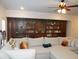 Comfortable living room featuring a large sectional sofa and built-in bookshelves at 3411 Swallowtail Ter, Duluth, GA 30096