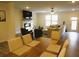 Open-concept living room with fireplace, TV, and dining area at 3411 Swallowtail Ter, Duluth, GA 30096