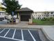 Community mailbox kiosk with brick accents, landscaping, and convenient parking space available at 3411 Swallowtail Ter, Duluth, GA 30096