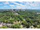 Homes surrounded by trees, with a beautiful city view in the distance at 3510 Roswell Nw Rd # N3, Atlanta, GA 30305