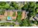 A beautiful aerial view showing a property with a swimming pool surrounded by mature trees at 3510 Roswell Nw Rd # N3, Atlanta, GA 30305