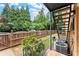 Private backyard with stairs leading to apartments above, bordered by a wooden fence at 3510 Roswell Nw Rd # N3, Atlanta, GA 30305