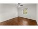 A well-lit room features a window, ceiling fan, and hardwood floors at 3510 Roswell Nw Rd # N3, Atlanta, GA 30305