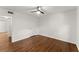 Bright bedroom features hardwood floors, a ceiling fan, and a closet at 3510 Roswell Nw Rd # N3, Atlanta, GA 30305