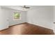 This bright bedroom has a ceiling fan and hardwood floors at 3510 Roswell Nw Rd # N3, Atlanta, GA 30305