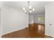 Bright dining room features hardwood floors, a modern chandelier, and plenty of natural light at 3510 Roswell Nw Rd # N3, Atlanta, GA 30305