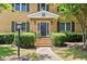 Entrance to apartment building with an 'N', a black door, and some brick steps at 3510 Roswell Nw Rd # N3, Atlanta, GA 30305