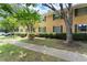 Apartment building with a manicured lawn, sidewalk, and mature trees in a garden-like setting at 3510 Roswell Nw Rd # N3, Atlanta, GA 30305