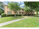 Apartment building with a manicured lawn, sidewalk, and mature trees in a garden-like setting at 3510 Roswell Nw Rd # N3, Atlanta, GA 30305
