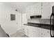 Bright kitchen featuring white cabinets, modern appliances, and a clean, functional layout at 3510 Roswell Nw Rd # N3, Atlanta, GA 30305