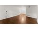 Bright living room with hardwood floors, white walls, and minimalist design at 3510 Roswell Nw Rd # N3, Atlanta, GA 30305