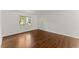 Living room with hardwood floors and a large window that brightens the space at 3510 Roswell Nw Rd # N3, Atlanta, GA 30305