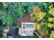 Aerial view of a new in-ground pool and patio in a wooded backyard at 6090 River Chase Cir, Atlanta, GA 30328