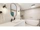 Modern bathroom boasts a sleek vanity, soaking tub, and frameless glass shower at 6090 River Chase Cir, Atlanta, GA 30328