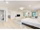 Spacious bedroom with hardwood floors, large windows, a comfortable bed, and an open doorway to the en-suite bathroom at 6090 River Chase Cir, Atlanta, GA 30328
