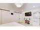 Primary bedroom features white walls, wood floors, soft blue accents, and barn doors at 6090 River Chase Cir, Atlanta, GA 30328