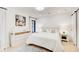 Bright bedroom features white walls, wood floors, soft blue accents, and natural light at 6090 River Chase Cir, Atlanta, GA 30328