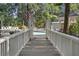Community pool area featuring an American flag and lush landscaping at 6090 River Chase Cir, Atlanta, GA 30328