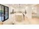 Sleek modern kitchen featuring stainless steel appliances, a central island, and hardwood floors at 6090 River Chase Cir, Atlanta, GA 30328